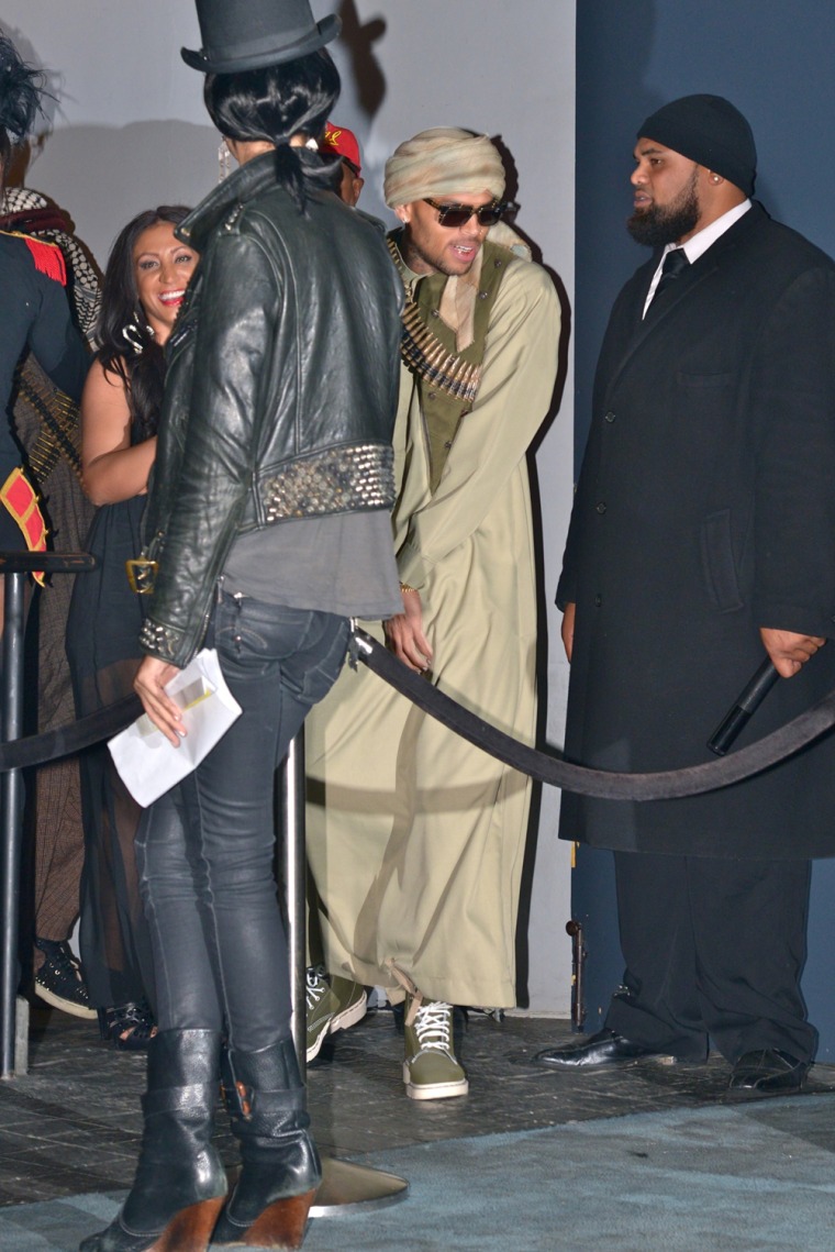 Chris Brown arrives at Rihanna's Halloween party Wednesday.