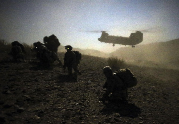 U.S. and Afghan soldiers and a U.S. Army Chinook during an operation near the town of Walli Was in Paktika province on November 1, 2012.