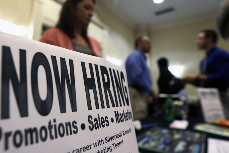 In this Thursday, Oct. 25, 2012, photo, a sign attracts job-seekers during a job fair at the Marriott Hotel in Colonie, N.Y. The October employment re...
