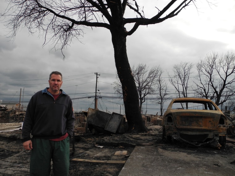 Joe Adinolfi, an off-duty firefighter, rescued nine people from 5 feet floodwaters and a raging fire when Hurricane Sandy struck his tiny seaside community of Breezy Point, N.Y., on Monday night.