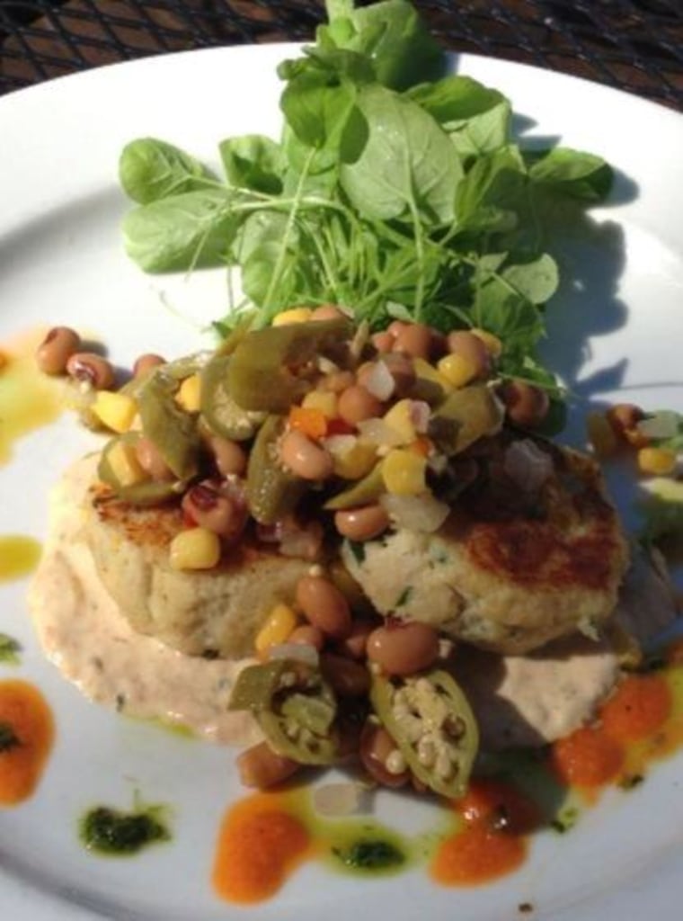 Crab cakes at Slate Table and Tap are topped off with black eyed peas, okra and corn salsa.