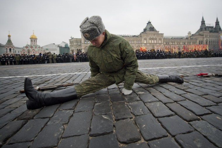 A Russian soldier warms up prior to the parade rehearsal.