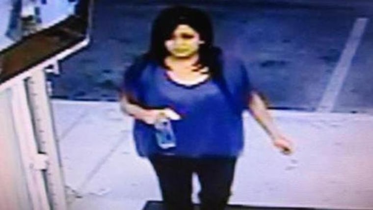 Charliena Cervera is seen in a Palmdale, Calif., market surveillance video running into the store to buy what turned out to be a $23 million jackpot-winning lottery ticket.
