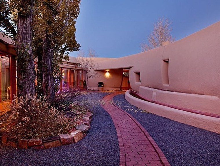 This adobe structure designed by Frank Lloyd Wright was built after the architect's death. The 5-bedroom, 4-bath home is on the market for $4.75 milli...