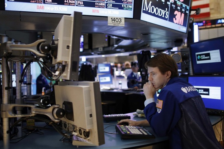 A trader looks at computer monitors while working on the floor of the New York Stock Exchange. Stocks opened higher on election day, setting up for th...
