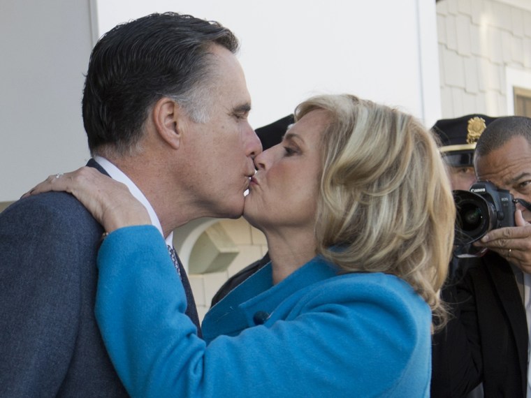 Republican presidential candidate Mitt Romney and his wife Ann kiss after casting their votes in Belmont, Mass., on Tuesday.