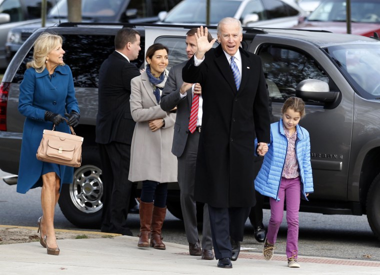 Vice President Joe Biden holds the hand of his granddaughter Natalie as he arrives with his family to vote in Greenville, Del., on Tuesday.