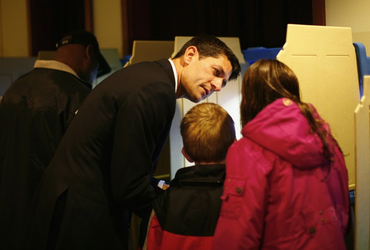 Ryan talks to his kids while voting.