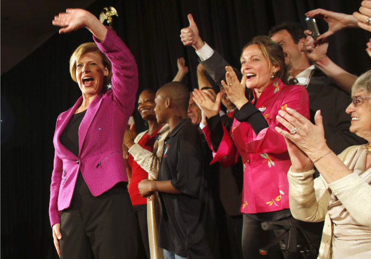 U.S. Rep. Tammy Baldwin celebrates her victory over former Republican Gov. Tommy Thompson on Tuesday.