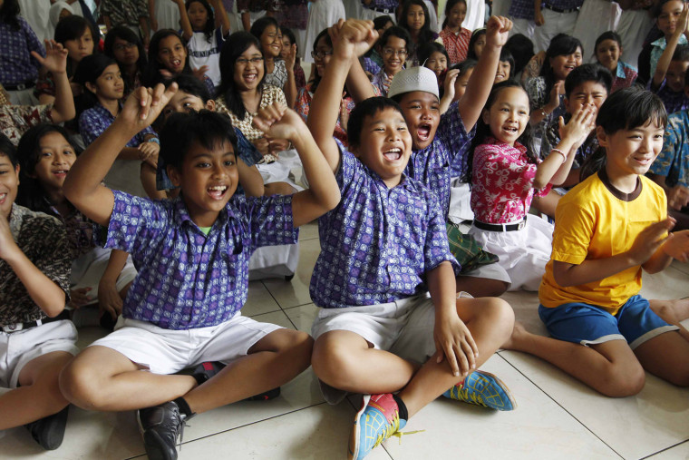 Students at State Elementary School Menteng 01, where U.S. President Barack Obama studied from 1970-1971, cheer in support of Obama while watching television coverage of the U.S. presidential election in Jakarta, Indonesia, Nov. 7.