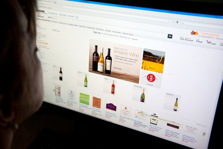 A jug of wine and thee. A woman shops for wine on Amazon's Internet site on Nov. 8, 2012 in Washington, DC. Amazon on Thursday launched an online win...