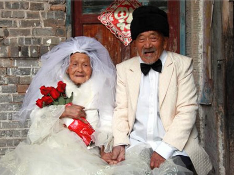 Wu Conghan, 101, and wife Wu Sognshi, 103, had their wedding photos taken 88 years later because cameras were scarce in China when they were married in 1924.