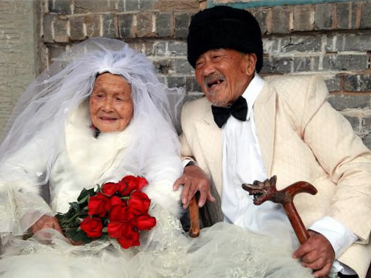 The beaming couple had their picture taken as part of an initiative by local amateur photographers to take pictures for elderly couples who were unable to have them when they were married.