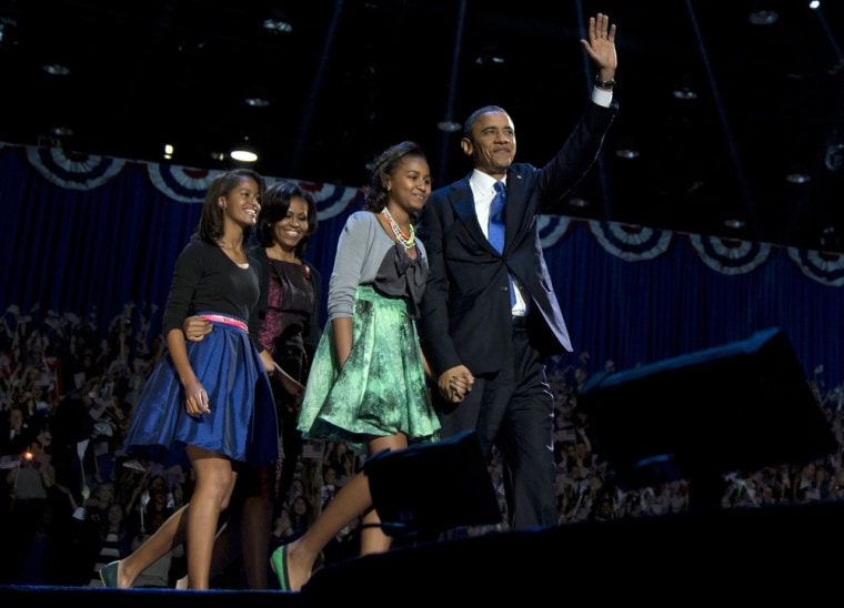 President Barack Obama, first lady Michelle Obama and daughters Malia and Sasha arrive at the Election Night party on Nov. 7 in Chicago. Sasha Obama is seen wearing a skirt first worn by her big sister Malia in 2011.