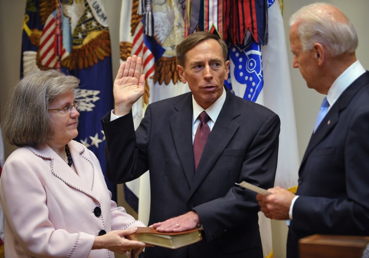 David Petraeus, center, takes the oath of office as the next director of the Central Intelligence Angency from Vice President Joe Biden, right, as Petraeus's wife Holly, left, watches on Sept. 6, 2011.