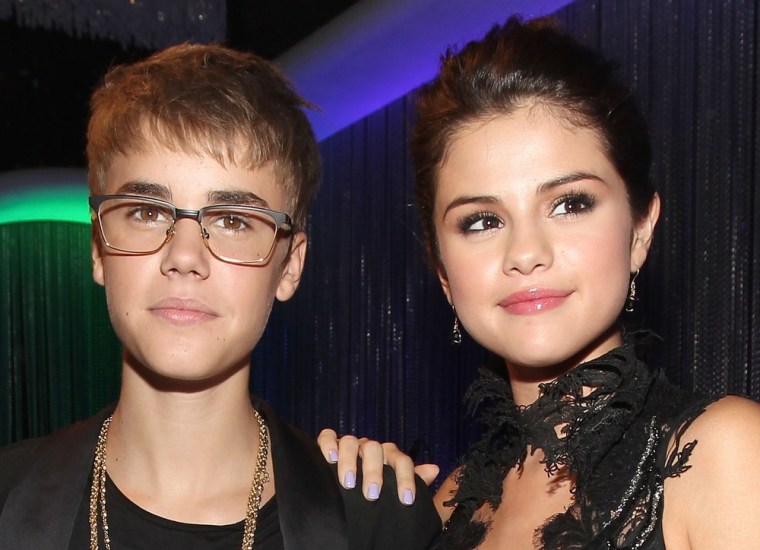 Justin Bieber and Selena Gomez, pictured together in August 2011, have broken up, according to E! News.