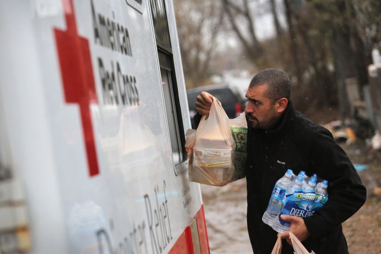 Robert Munoz collects supplies from a mobile Red Cross unit on Nov. 7, in the Staten Island Borough of New York City.
