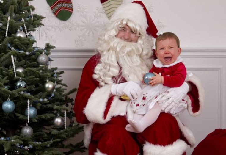 Kailani, 11 months, is not a happy camper on Santa's lap.