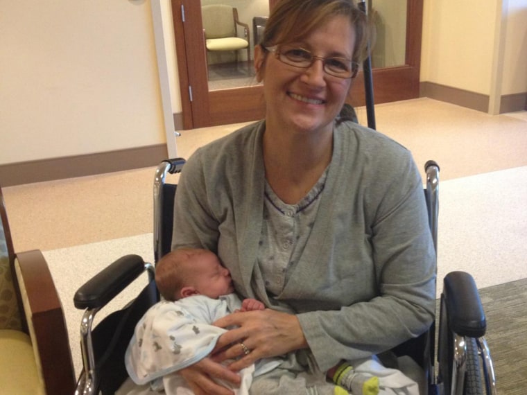 Margaret Snopkowski, 51, of Michigan, holds her 11-day-old grandson, Ethan Edward Jackson. She missed the baby's birth after becoming gravely ill with fungal infections tied to tainted drugs in a national outbreak.