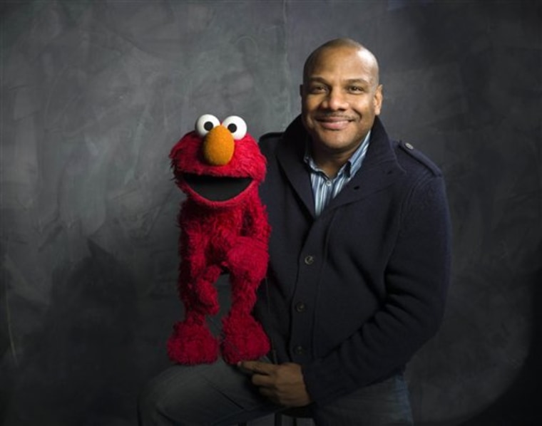 \"Sesame Street\" muppet Elmo and puppeteer Kevin Clash.
