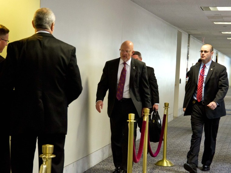 National Intelligence Director James Clapper(C) arrives for a closed door hearing conducted by the Senate Select Committee on Intelligence November 15, 2012 on Capitol Hill in Washington, DC.PHOTO/Karen BLEIERKAREN BLEIER/AFP/Getty Images