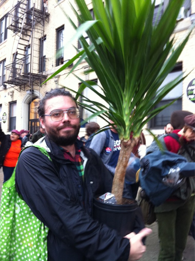 Yates McKee, 32, brought a housewarming gift on the march.