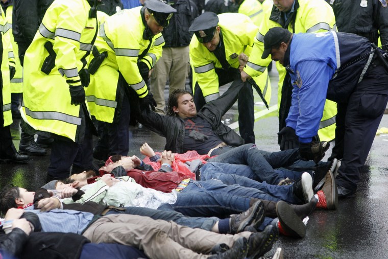 Police arrest Occupy DC demonstrators who blocked K Street in downtown Washington on Wednesday.The protesters converged on K Street, home to many lobbying firms, to highlight their dissatisfaction with corporate influence in politics.