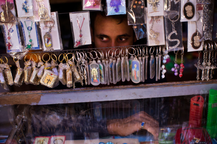 A Coptic vendor waits for customers near Mar Girgis Monastery, near Luxor, Egypt, on Nov. 12.