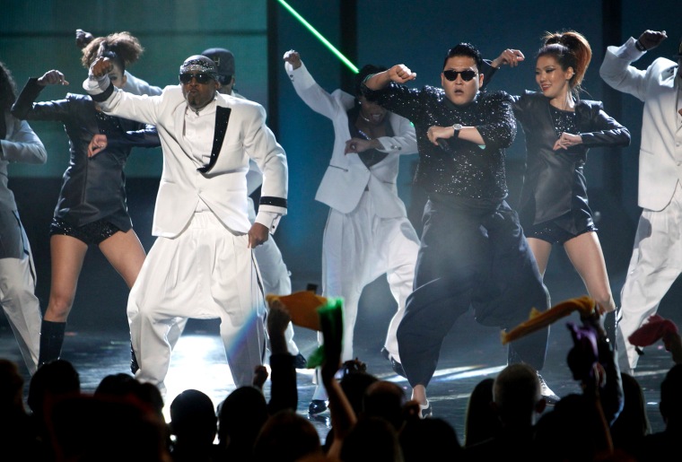 South Korean rapper Psy performs \"Gangnam Style\" with MC Hammer at the AMAs.