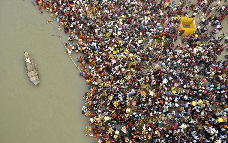 Hindu devotees take part in worship on the banks of the River Ganges river during Chhath festival, an ancient Hindu festival, rituals are performed to thank the sun god for sustaining life on earth, in Patna, India, on Nov. 19.