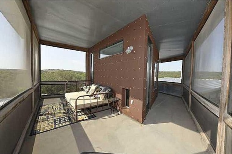 Situated alongside the Pedernales River, the home features screened-in sleeping porches.