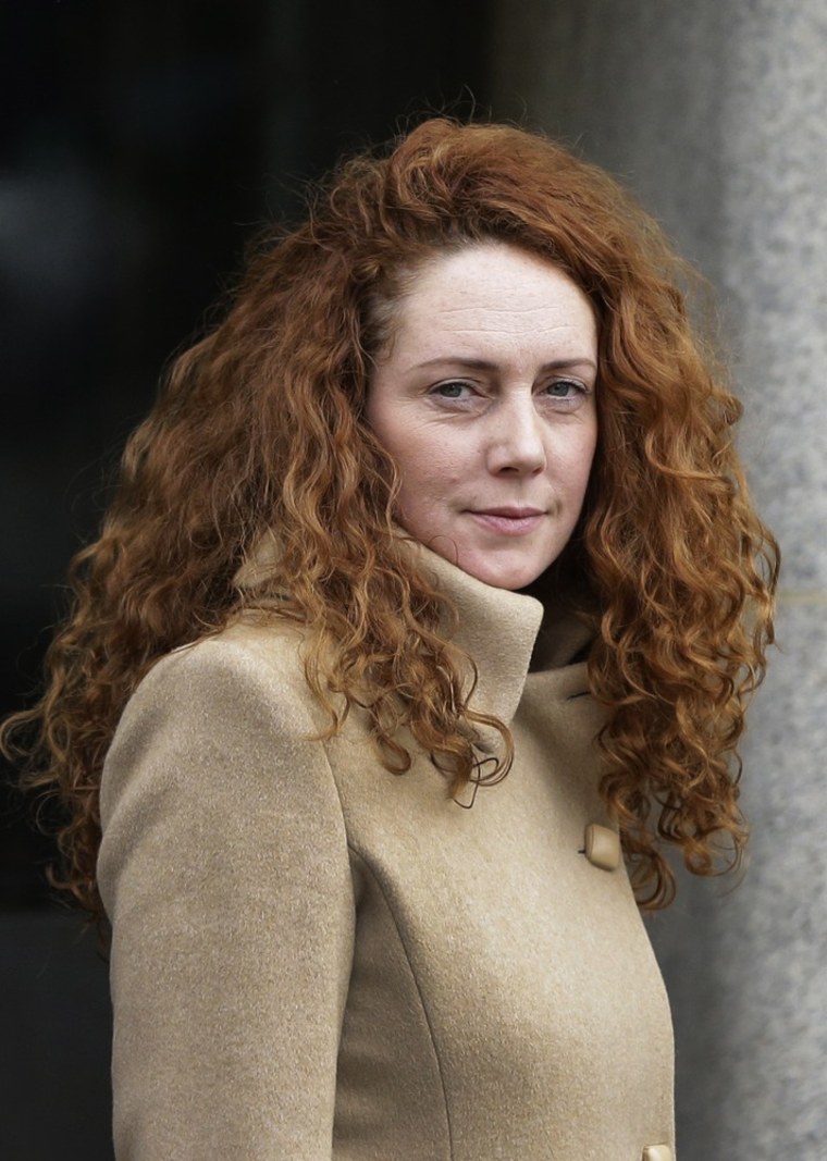 Rebekah Brooks, the former chief of News Corp.'s British operations, seen here outside a London court in September, was told Tuesday that she would be charged with making illegal payments to defense officials.