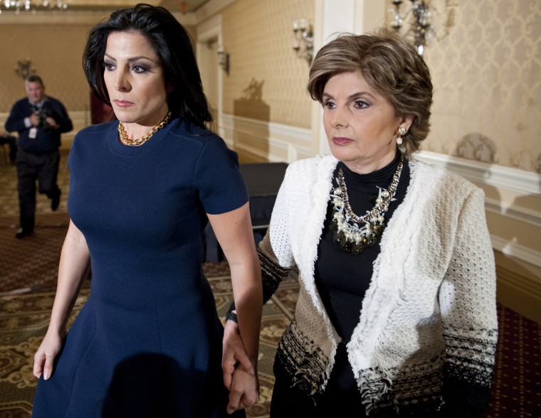 Natalie Khawam, accompanied by her attorney Gloria Allred, leaves a news conference in Washington, Nov. 20, 2012.