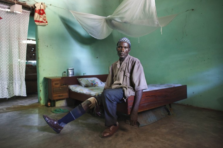 Former independence fighter Samba Diakite, 69, shows his prosthetic leg in his bedroom in Gabu, Guinea-Bissau, Nov. 3. In 1969, Diakite lost his leg in a mine blast set by the Portuguese army. Today there are still live mines in Guinea-Bissau's countryside, planted by the Portuguese during the independence war.