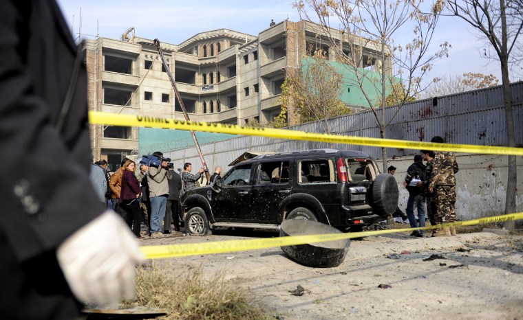 A destroyed vehicle is pictured at the scene of a suicide attack in Wazir Akbar Khan district of Kabul on Nov. 21, 2012. A suicide bomber blew himself up near a NATO base in Kabul's diplomatic district on Wednesday, hitting a military vehicle and killing two people, police and a military spokesman said.