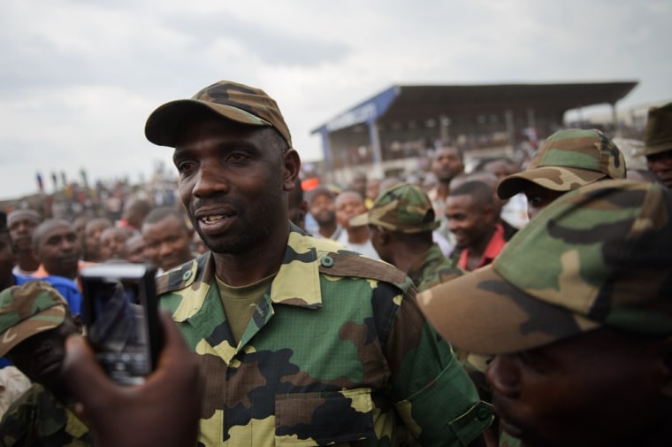 Spokesman of the M23 rebel group Lieutenant-Colonel Vianney Kazarama arrives at the Volcanoes Stadium in Goma on November 21, 2012. Kazarama addressed the population of Goma in an attempt to calm and reassure the civilians following the fall of Goma to M23 rebels yesterday.