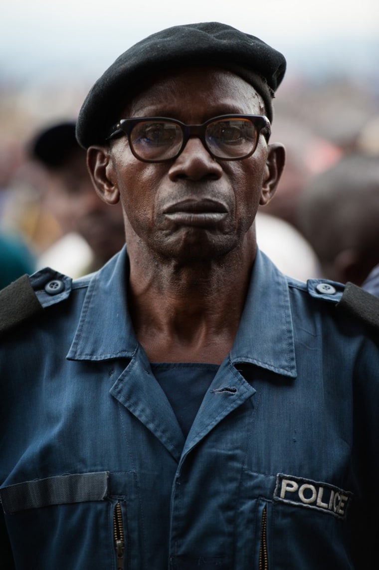 A surrendered police officer stands at the Volcanoes Stadium in Goma on November 21, 2012.