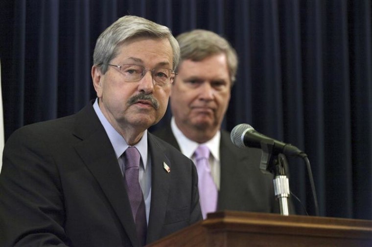 Iowa Governor Terry Branstad speaks as U.S. Agriculture Secretary Tom Vilsack looks on during a news conference at the Iowa State Capitol March 28, 2012.
