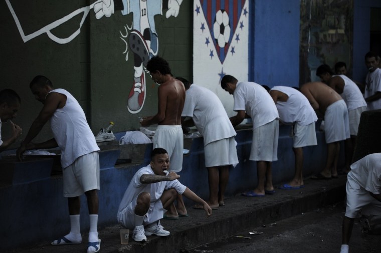 Inmates wash themselves at La Esperaza Jail in San Salvador.