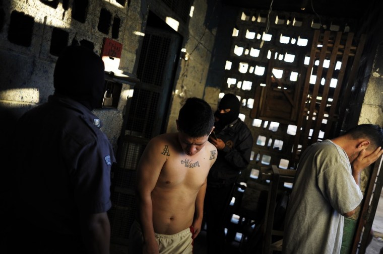 Inmates walk out of their cells after the morning counting at La Esperaza.