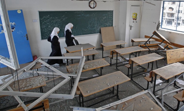Palestinian school girls inspect their school, which witnesses said was damaged in an Israeli air strike, in Gaza City on Nov. 24.