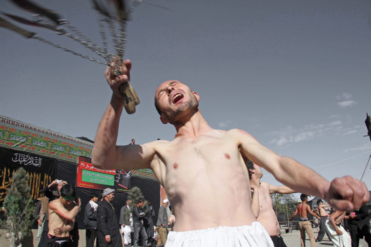Afghan Shiite Muslims flagellate themselves during an Ashoura procession in Kabul on Nov. 24.