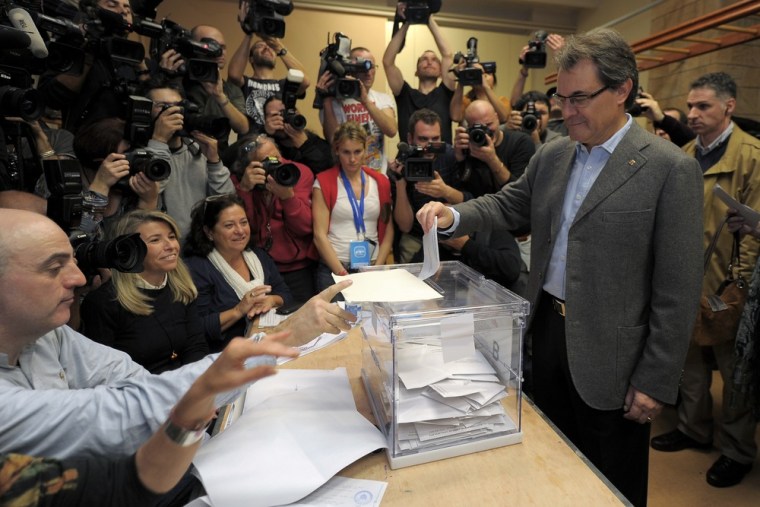 Current President of Catalonia and leader of the CiU (Catalan Convergence and Unity) party Artur Mas casts his ballot for regional elections in Barcelona on Sunday.