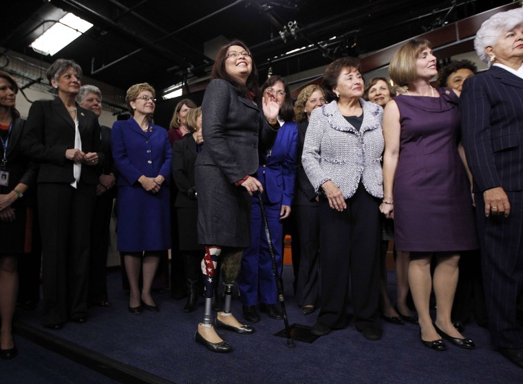 Tammy Duckworth, D-Ill., U.S. representative-elect for Illinois' 8th Congressional District, is pictured with other female members of Congress on Capitol Hill in Washington on Nov. 14. Duckworth, a helicopter pilot in the Iraq war who was shot down and lost both her legs in the attack, is the first disabled woman to be elected to the House of Representatives.