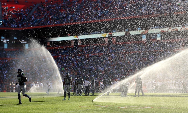 The sprinklers go off as the Miami Dolphins play against the Seattle Seahawks at Sun Life Stadium on November 25, 2012 in Miami Gardens, Florida. Miami defeated Seattle 24-21.