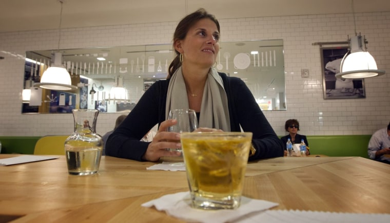 Traveler Liz Lamoureux sits in the Food Network Kitchen at the Fort Lauderdale-Hollywood International Airport, in Fort Lauderdale, Fla., sipping a gl...