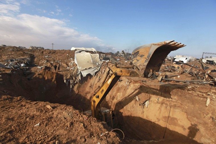 An excavator operates at the site of a destroyed smuggling tunnel dug beneath the Egyptian-Gaza border in Rafah in the southern Gaza Strip on Nov. 26.
