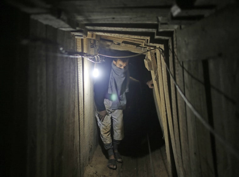 A Palestinian smuggler waits for a cart containing gravel inside a smuggling tunnel dug beneath the Egyptian-Gaza border in Rafah.