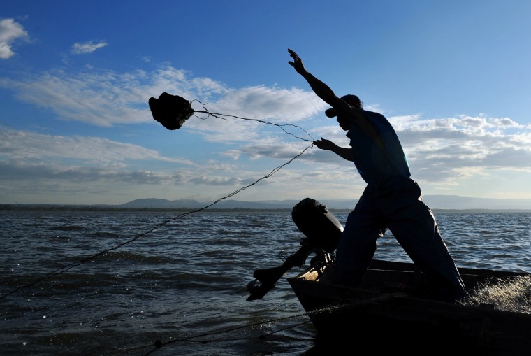 Thirty-five-year-old fisherman Adonis Mena, throws his fishing net into the waters of Xolotlan Lake in Tipitapa, some 12 miles from the capital, on Nov. 20.