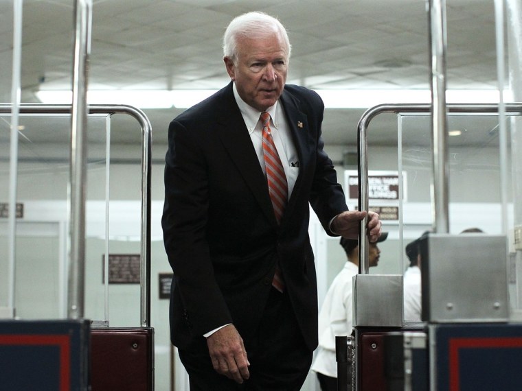Select Committee on Intelligence ranking member Sen. Saxby Chambliss (R-GA) gets on the Senate subway as he leaves after a hearing on the Benghazi attack November 16, 2012 on Capitol Hill in Washington, DC.